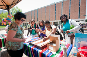 photo of students at a vendor table