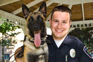 photo of police offier and dog
