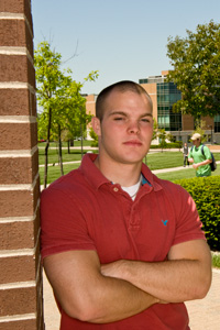 photo of a student standing outside