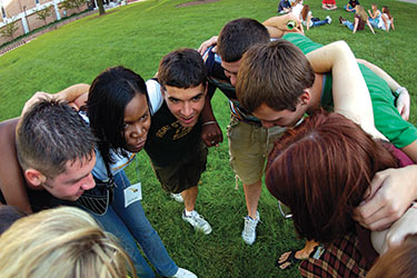photo of a peer mentor and students