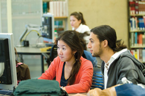 photo of two students using a computer