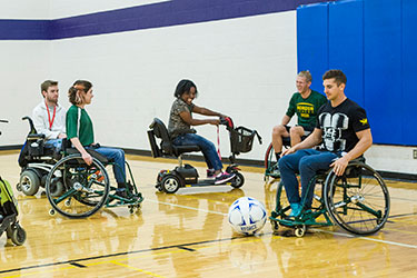 photo of students playing indoor soccer