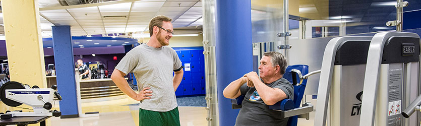 photo of two staff members in the fitness center