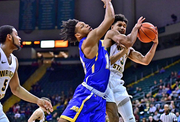 Wright State’s Mark Hughes pulls down a rebound against Morehead State on Tuesday, Dec. 18, 2018, at the Nutter Center. 