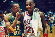 Wright State’s Joe Jackson walks off the court with Dayton’s Anthony Corbitt after the first Gem City Jam game on March 5, 1988, at UD Arena.