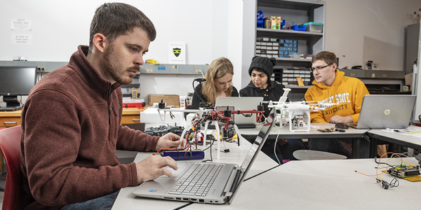 students working in a classroom together