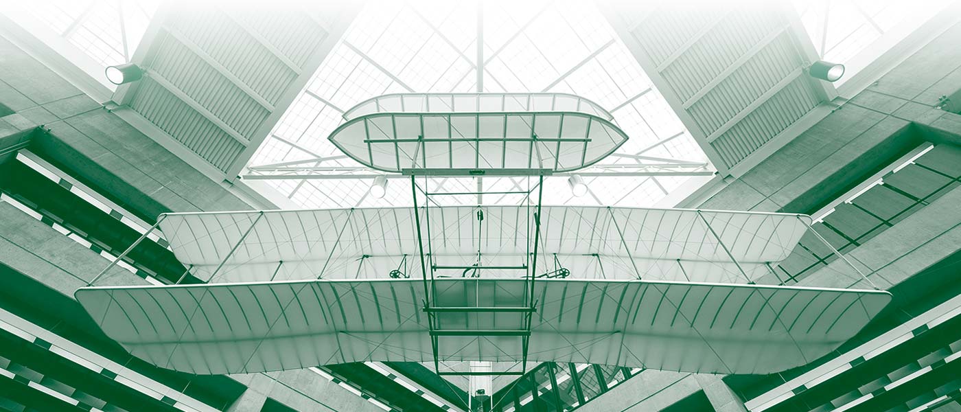 Photo looking up at the replica Wright "B" Flyer, installed above the second floor of Paul Laurence Dunbar Library