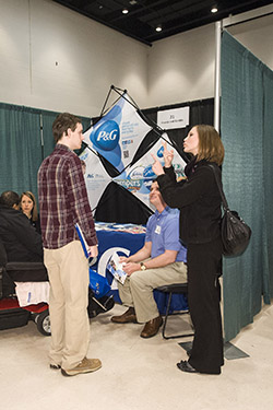 photo of a student communicating with a recruiter at a career event