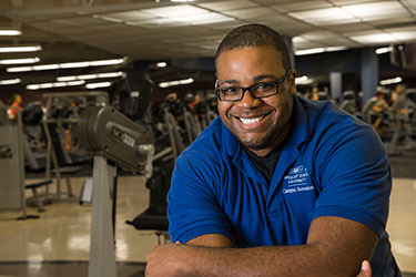 photo of a student employee in the fitness center