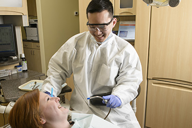photo of a dental student and patient