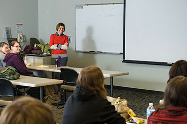 photo of a professor and students in a classroom
