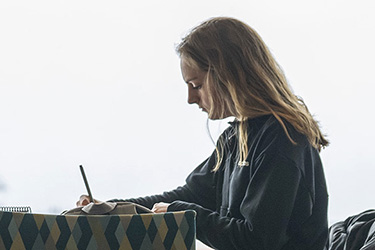 photo of a student studying in the library