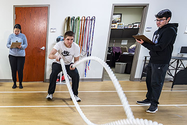photo of two students working with a patient