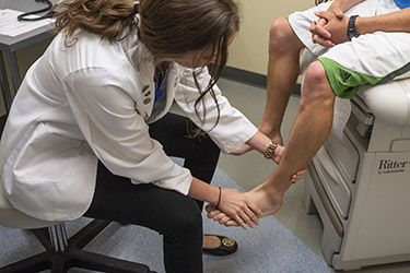 photo of a medical student with a patient