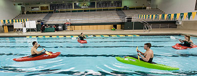 photo of people kayaking in the pool