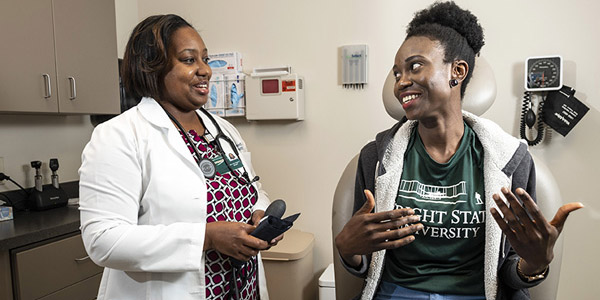 Nurse talking to a wright state student