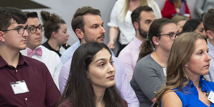 photo of a group of people sitting in a meeting room