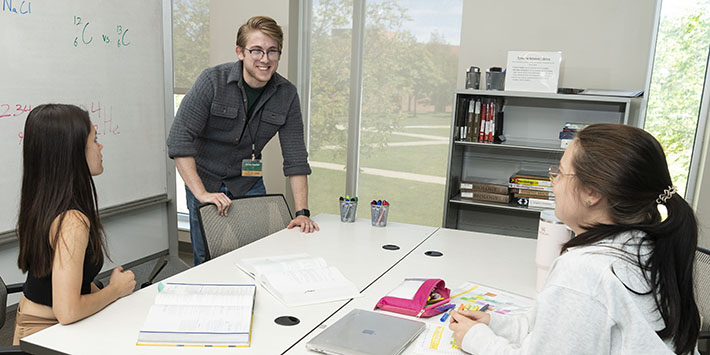 photo of three students in a study session in the student success center
