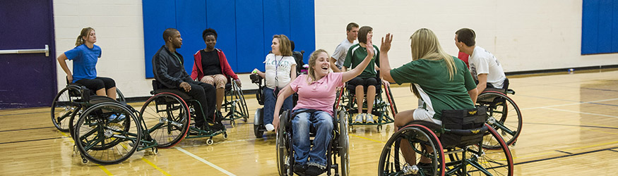 photo of students playing wheelchair basketball