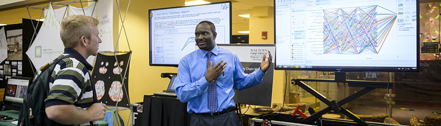 photo of a student at a booth at wright brothers day