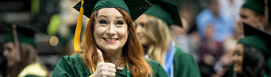 photo of a smiling graduate at commencement