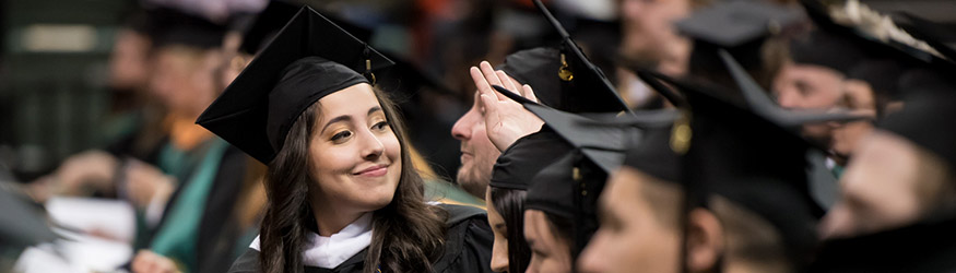 photo of a smiling graduate at commencement