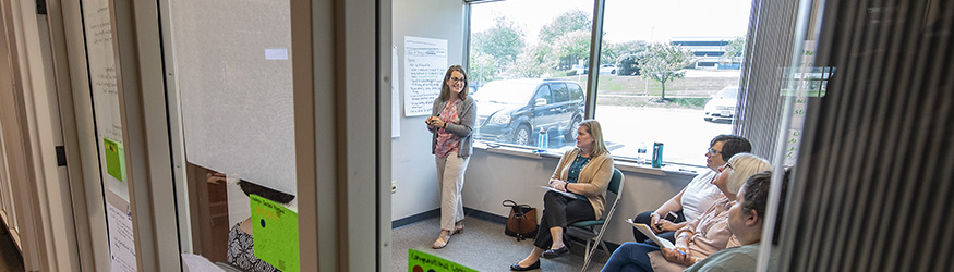 photo of employees in a meeting