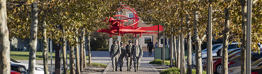 photo of students walking outside on campus 