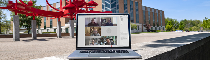 photo of a laptop with a webex meeting on the screen