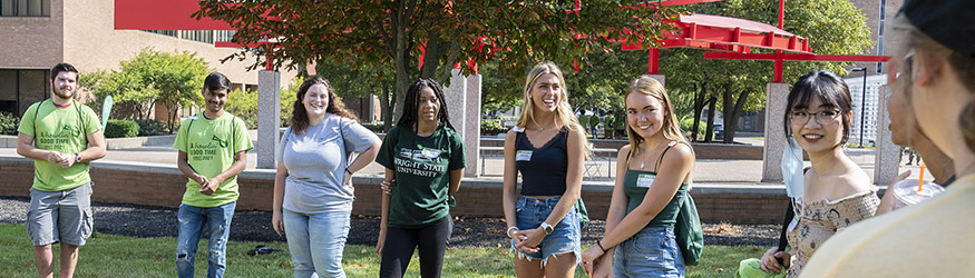 photo of students outside on campus at a first weekend event