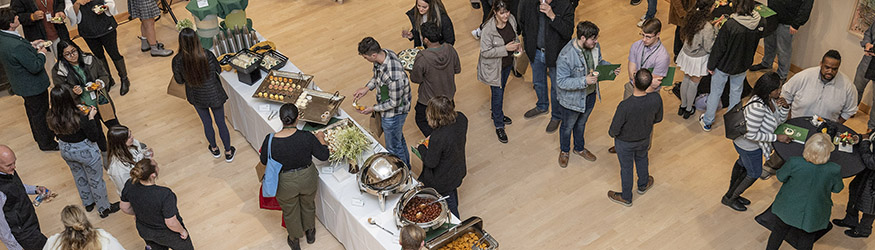 photo of a buffet table and people at a reception in the art galleries