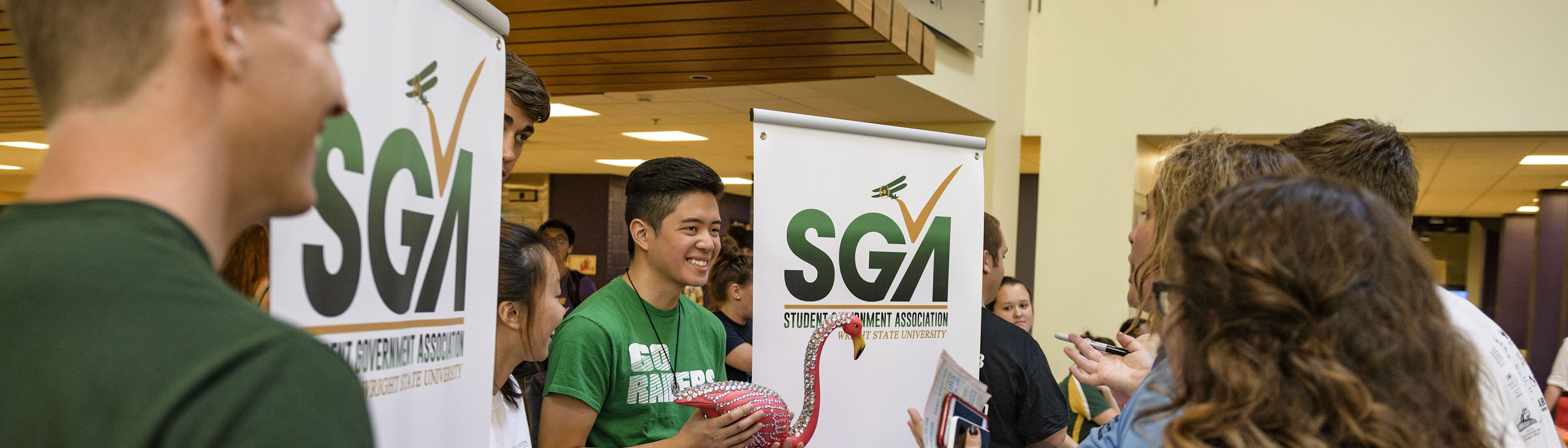 photo of a sga members at do the u in the student union