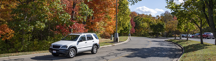 photo of a suv driving on campus