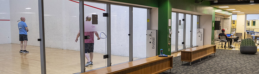 photo of two people playing racquetball