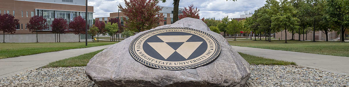 photo of the rock with the university seal on campus