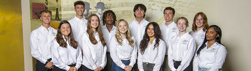 photo of presidential scholars posing in front of wall