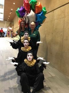 Three mimes and two staff members plus balloons