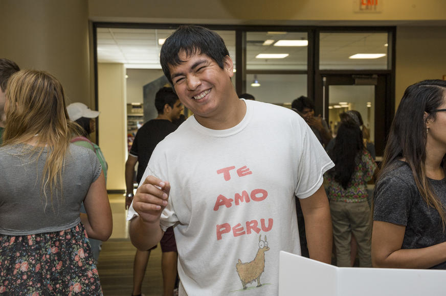 photo of a smiling student at an event on campus