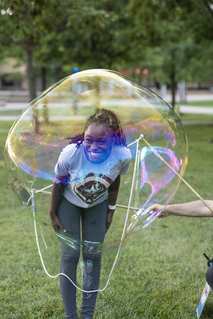photo of a student at an event on campus