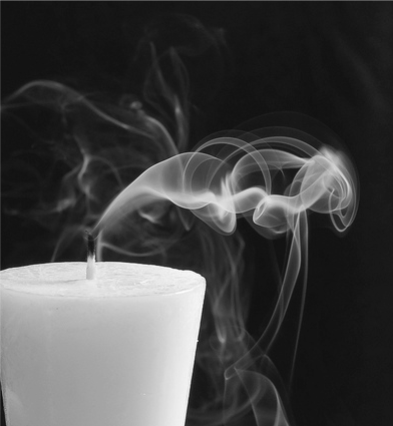 blown out candle with smoke whisps