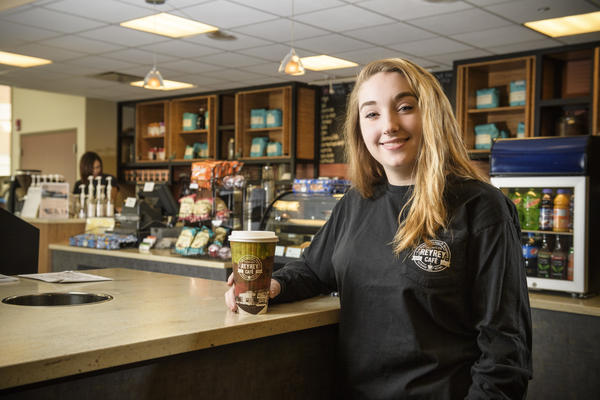 student working at rey rey cafe