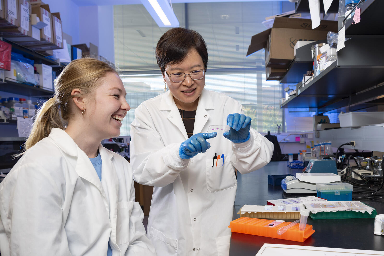 photo of a student and professor in a lab