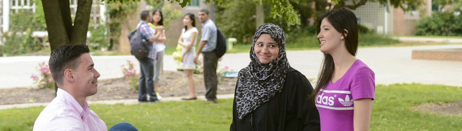 photo of students talking outside on campus