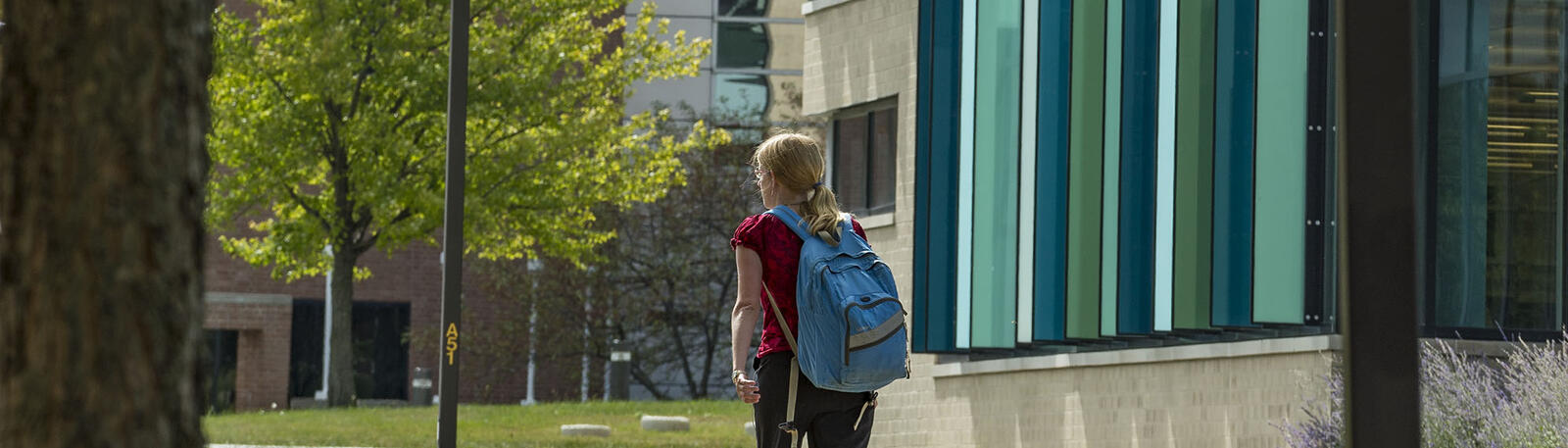 photo of a student walking on campus