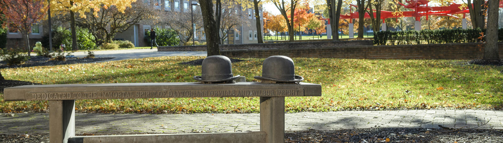 photo of the bench and wright brothers hats on wright state's campus 