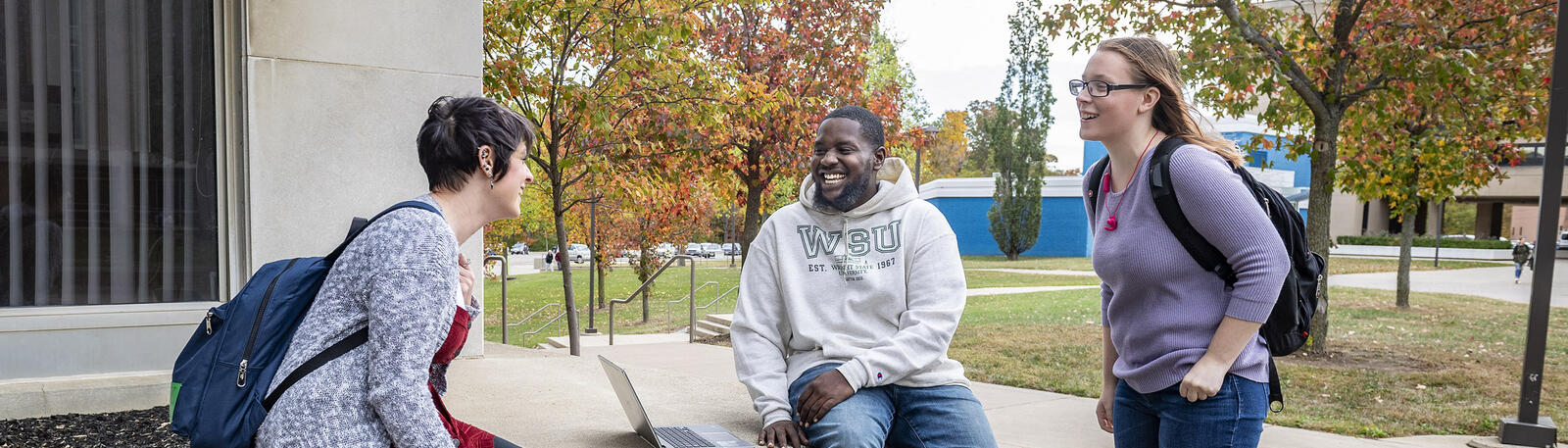 photo of student talking outside on campus