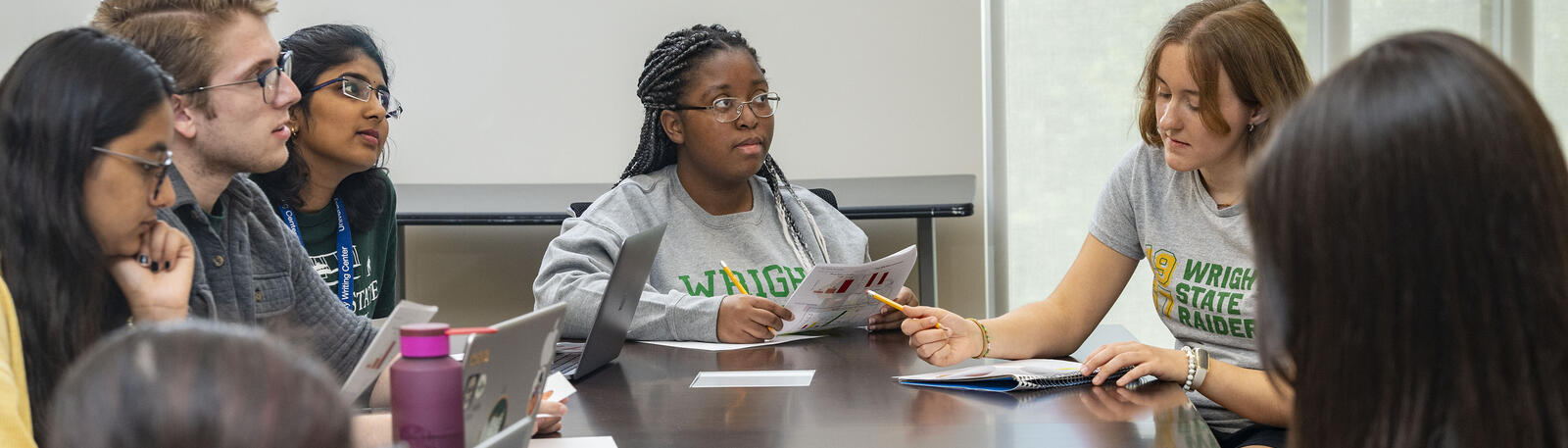 photo of students studying at a table in the student success center