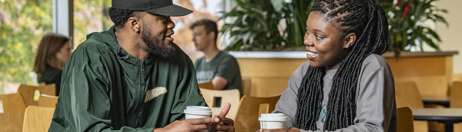 photo of students sitting at a table in the union market