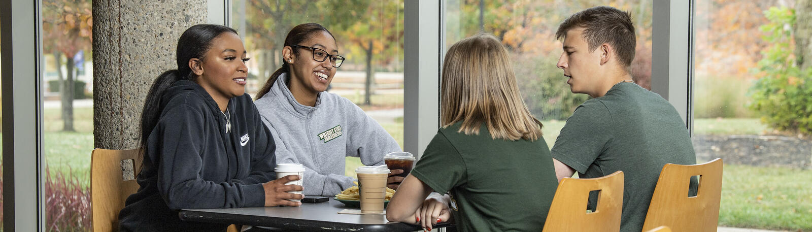 photo of students sitting at a table in the union market