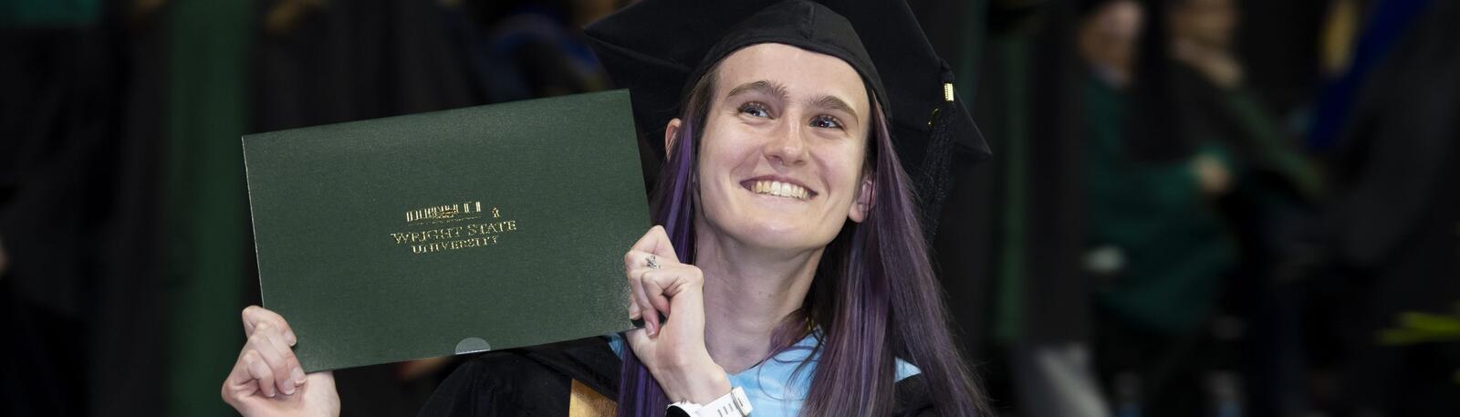 photo of a happy graduate at commencement at wright state